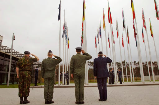 body-NATO-soldiers-saluting-flags