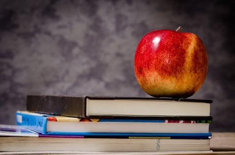close-up-of-apple-on-top-of-books-256520-1